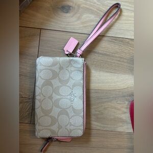 Light pink and gold Coach wristlet